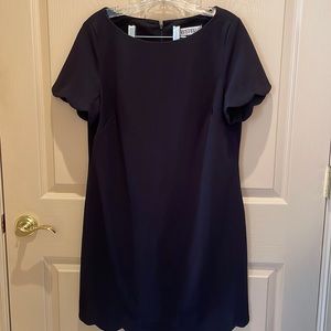 Black dress by Kasper s12p with scalloped edging on sleeve and hem